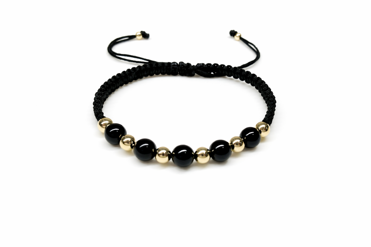 Handcrafted black macrame bracelet with 14K gold beads and black onyx stones
